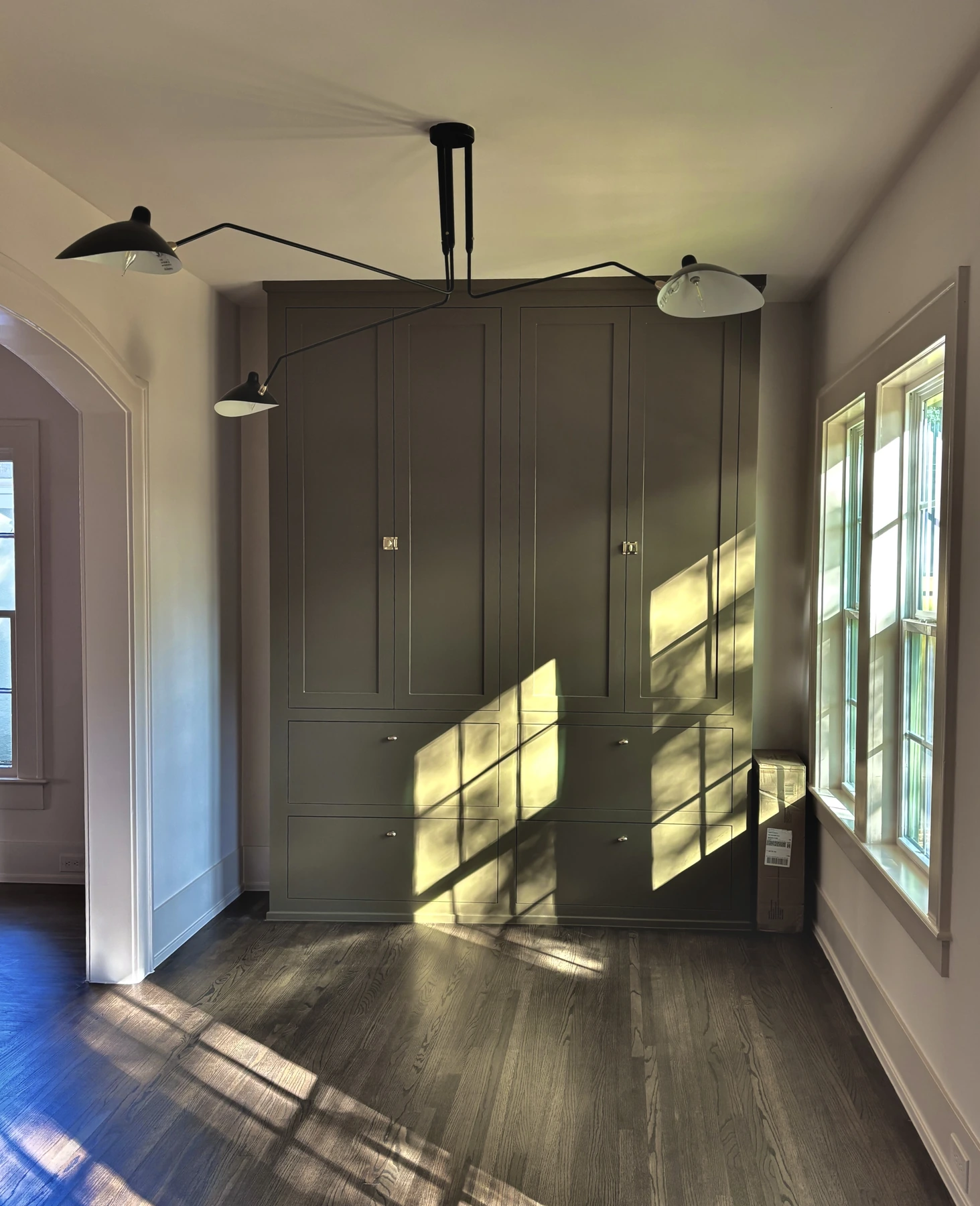 Custom built-ins — Cabinet details, hardware, and wood flooring.