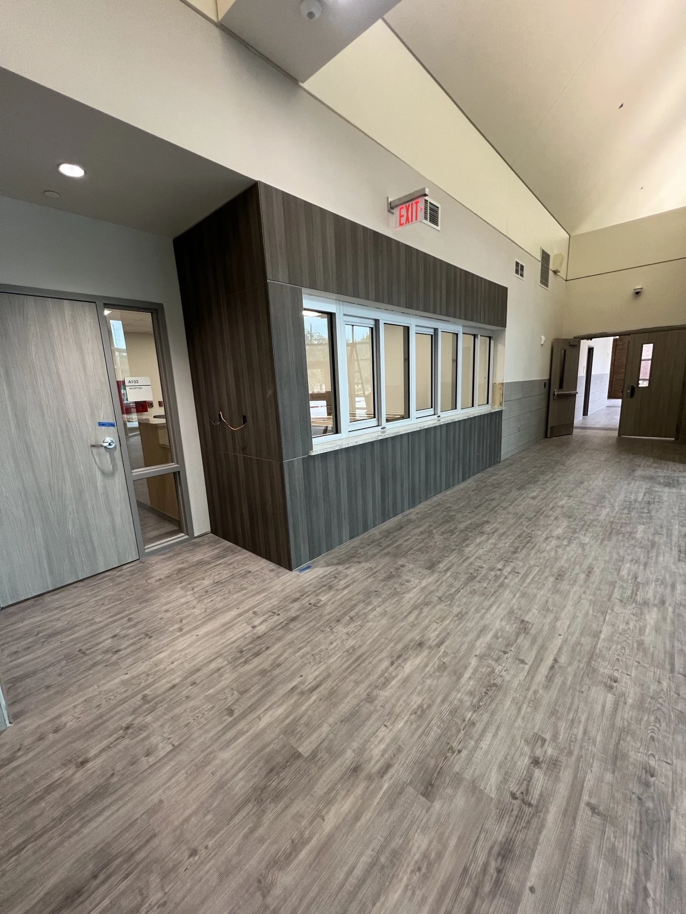 Commercial reception windows, wall panels, and flooring